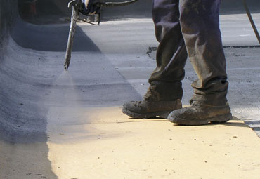 Coating systems over Juno spray foam roof systems